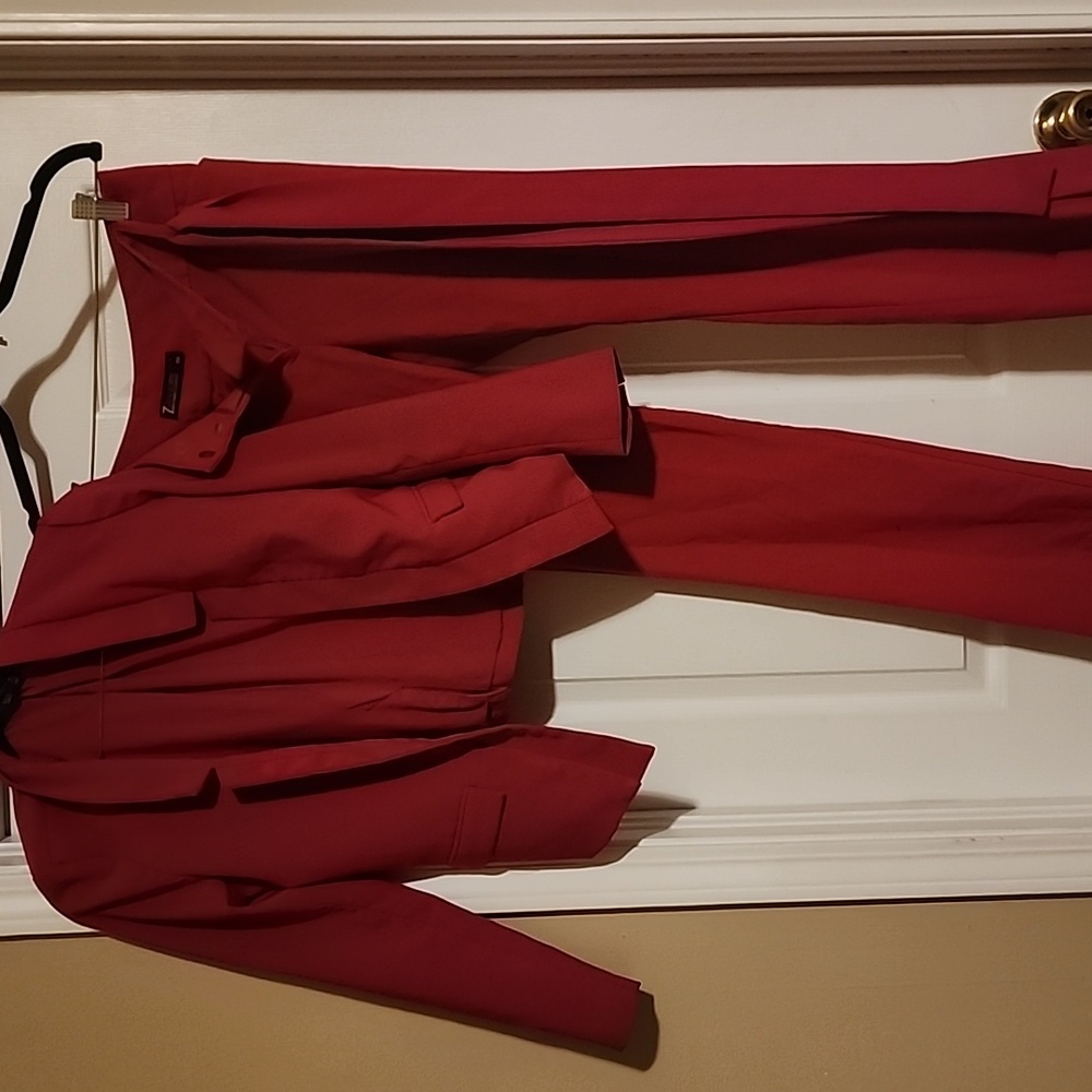 Hot pink pants suit with belt